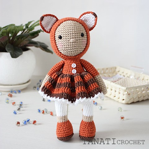 Crochet doll in fox clothes