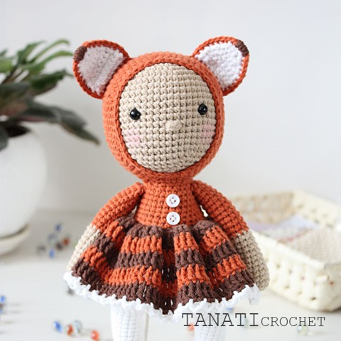 Crochet doll in fox clothes