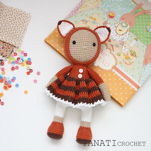 Crochet doll in fox clothes