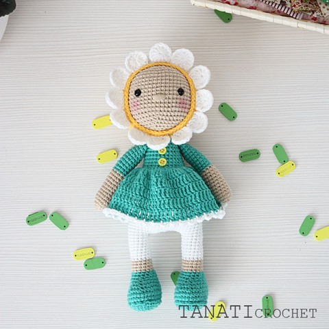 Crochet doll in chamomile clothes