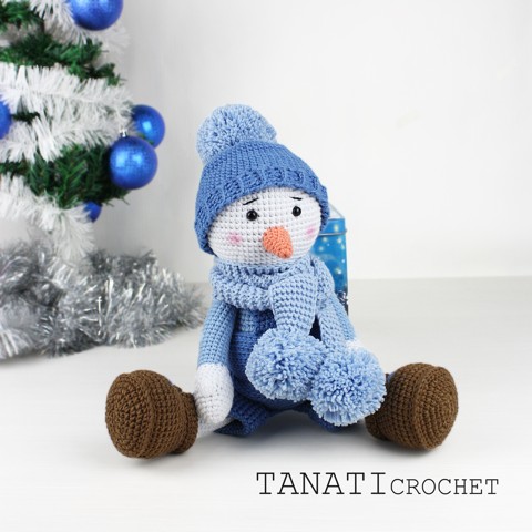 Crochet toy snowman in clothes